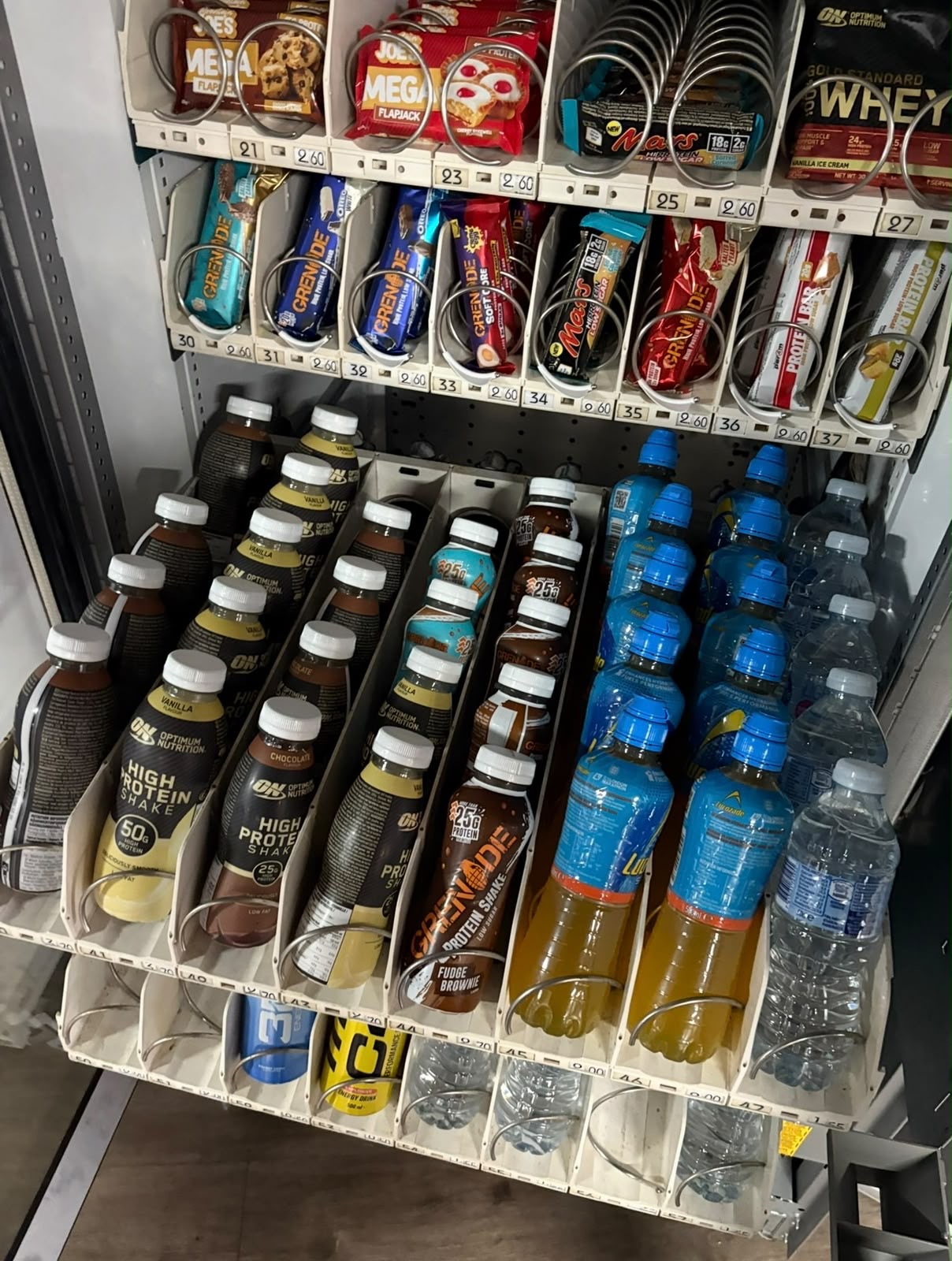 Close-up of high-protein bars and shakes stocked in the machine